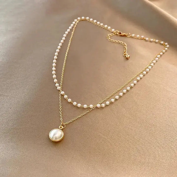Elegant pearls in gold necklace